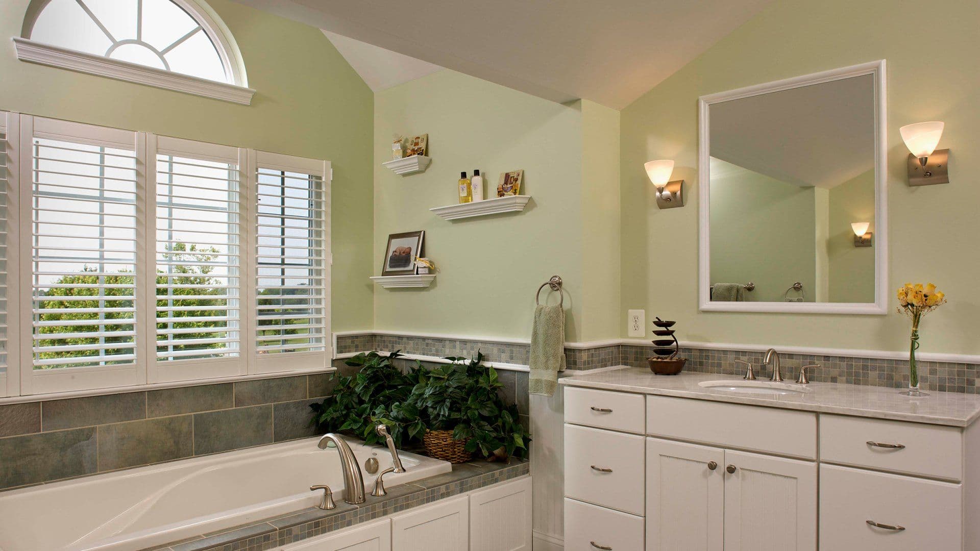 Restored bathroom with tile and white vanity
